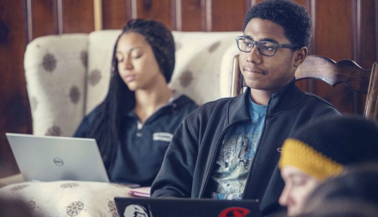 students studying on laptops