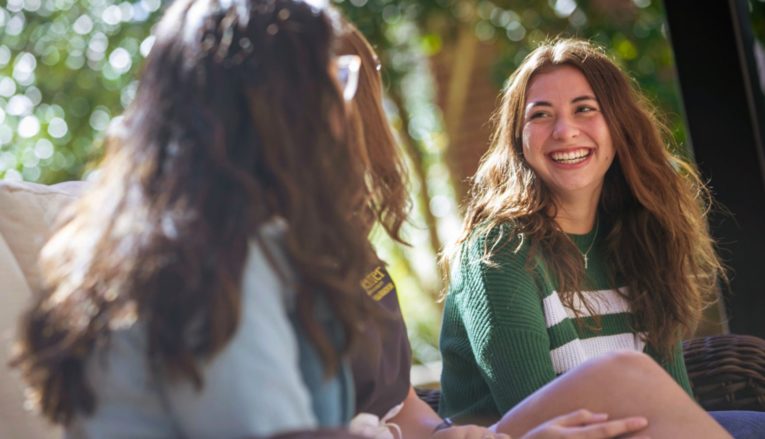 two students talking on campus