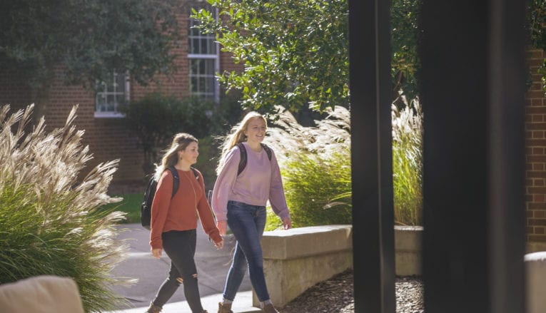 two students walking and talking