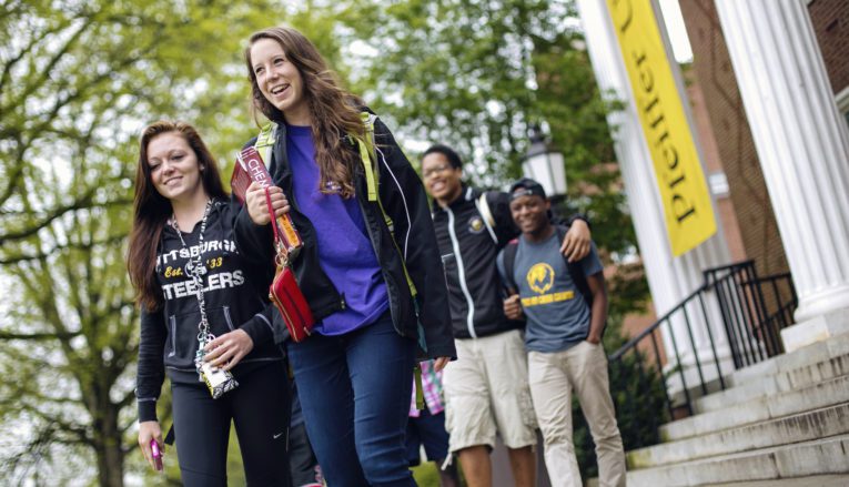 Group of students walking outside on Pfeiffer campus