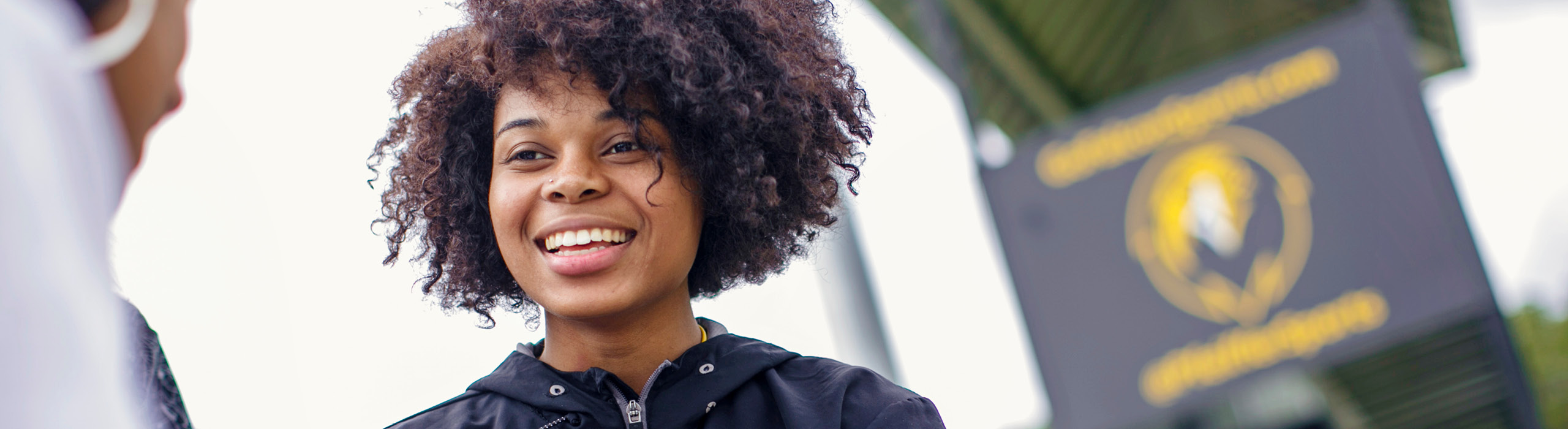 Woman smiling at friend