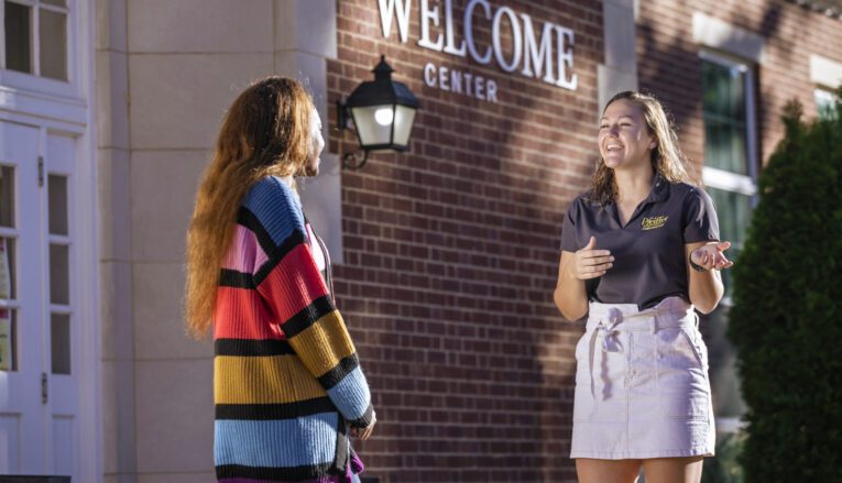 A student ambassador talking to a young woman