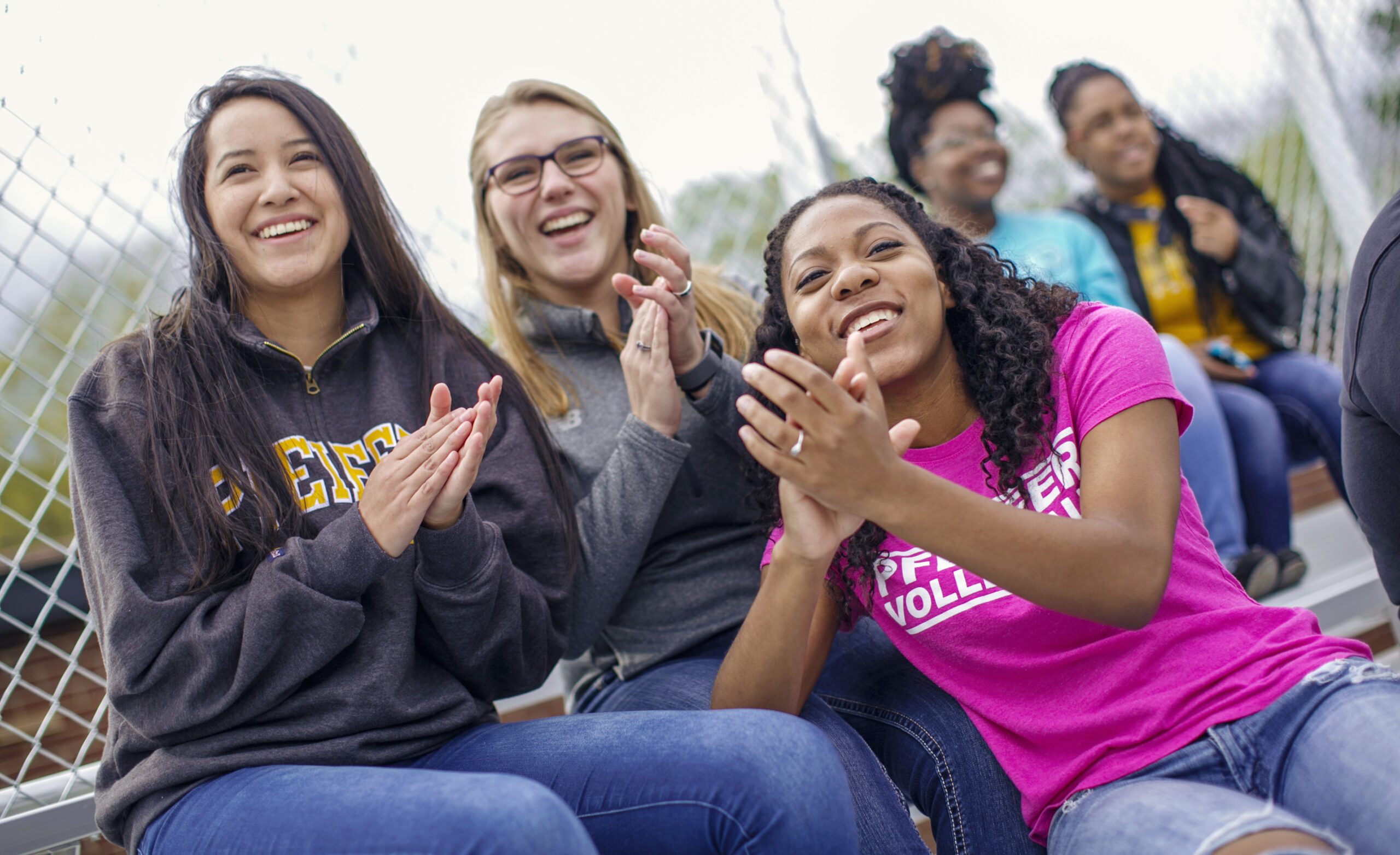 diverse friends clapping