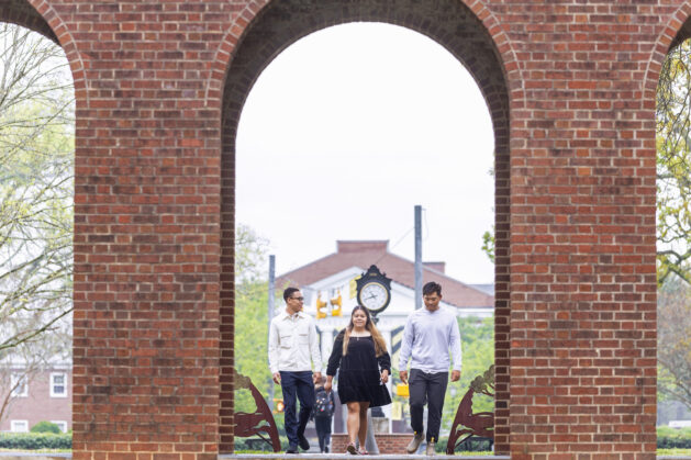 Students walking through Arch